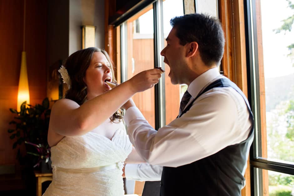 couple feeding cake to each other