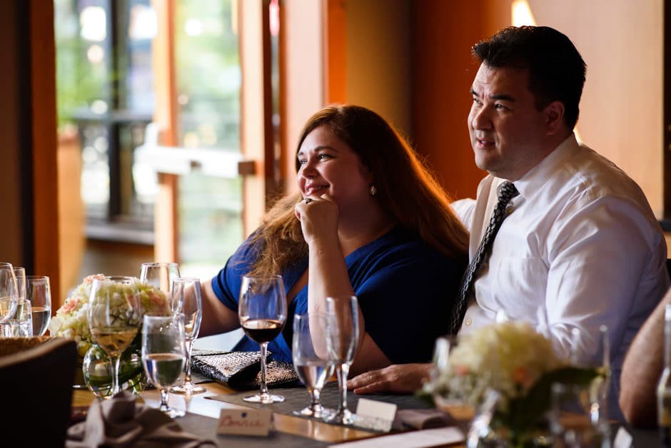 relatives cuddling and listening to wedding toast