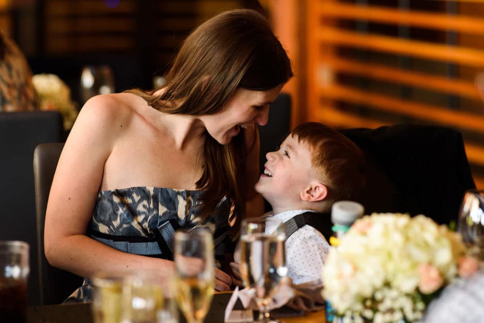 ring bearer and mom laughing