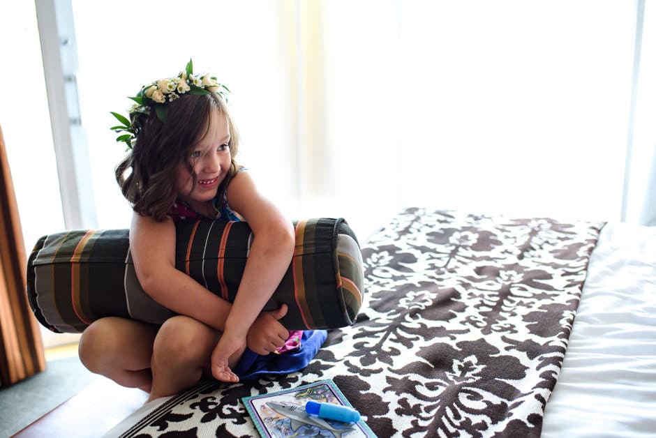 flower girl on bed before wedding