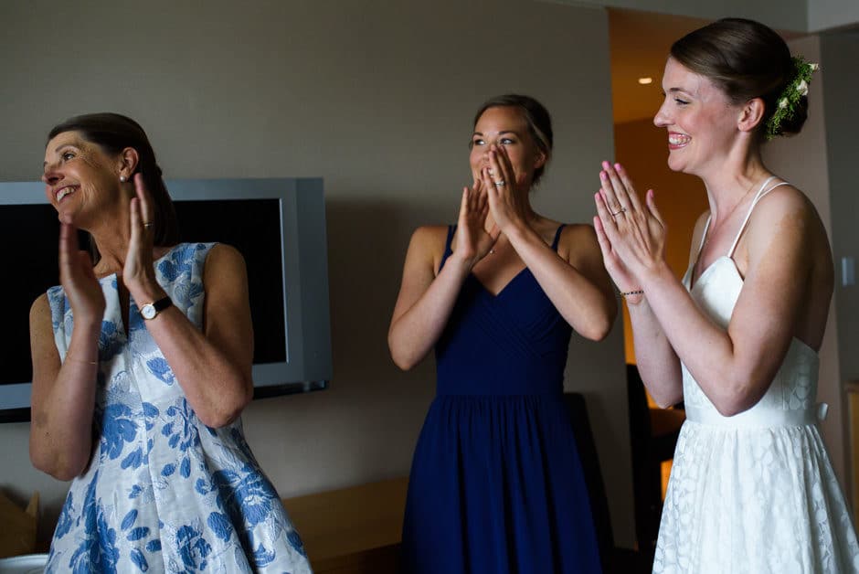 bridesmaids cheering at rain stopping