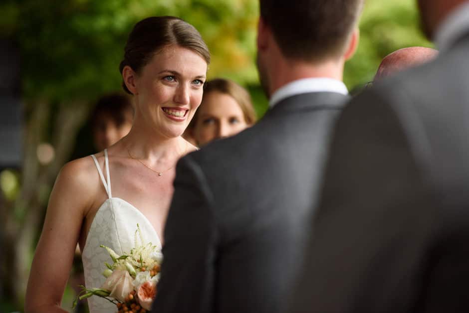 bride smiling during wedding ceremony