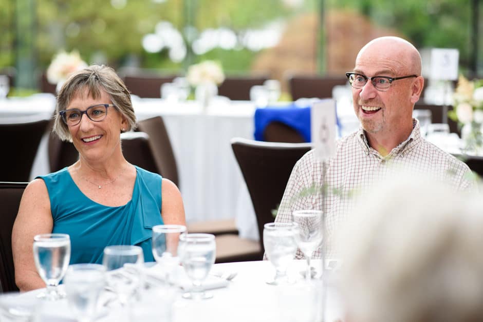 aunt and uncle laughing at wedding reception