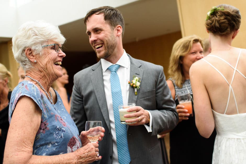 groom and grandma laughing