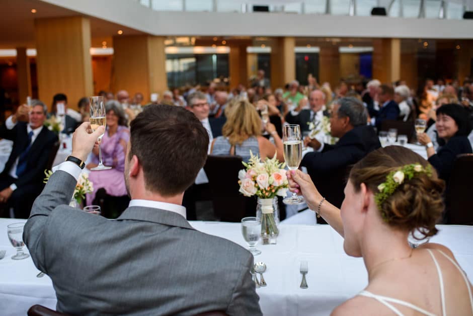 bride and groom toasting the room