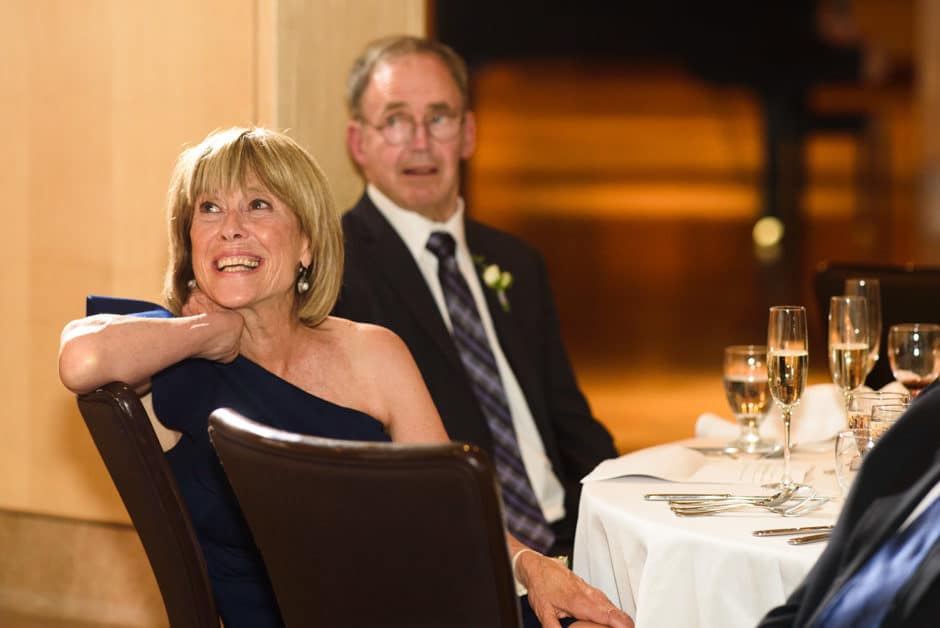 groom's parents watch toast