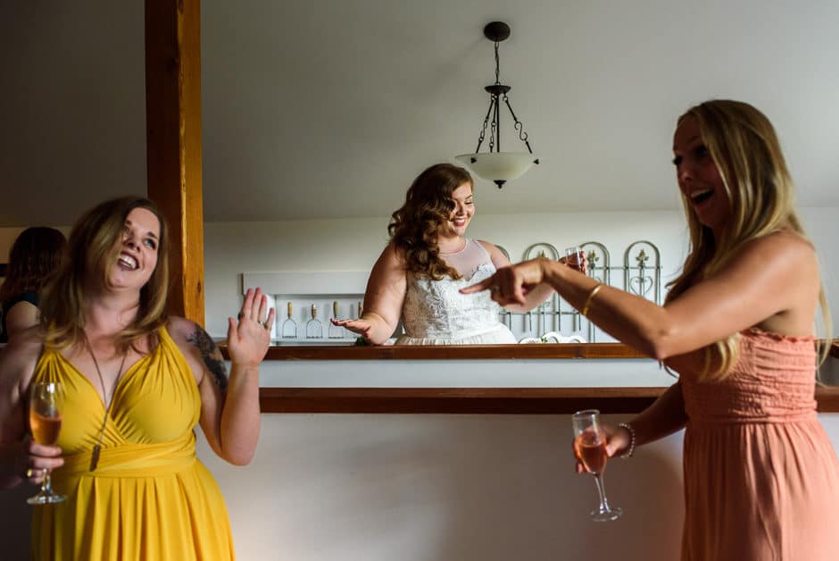 wedding party and bride dancing during getting ready