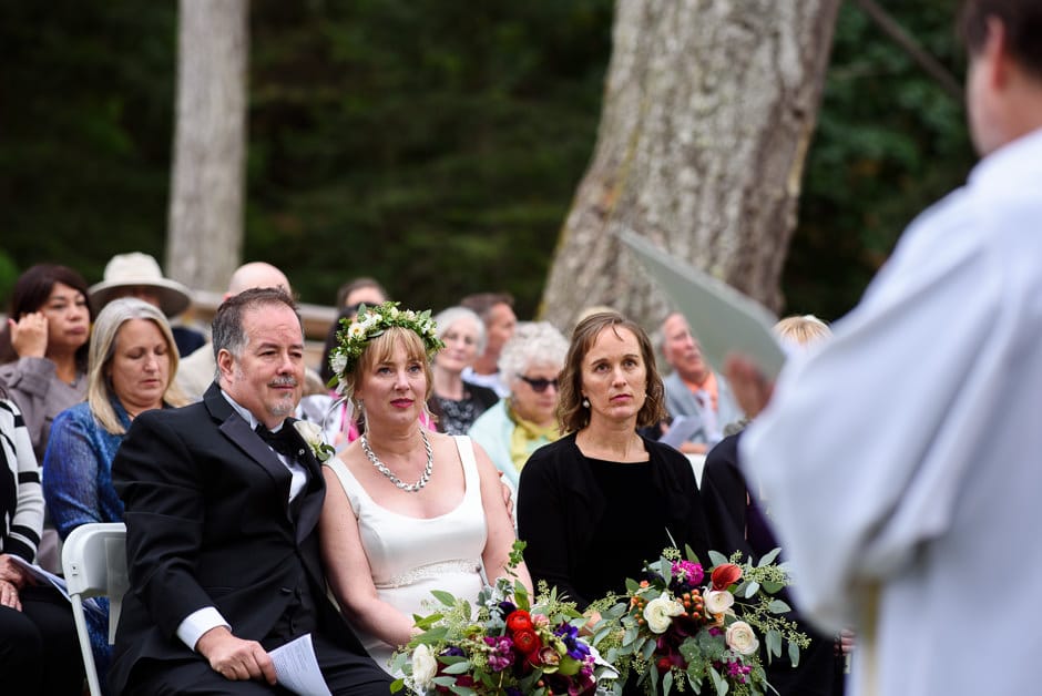 couple emotionally listening to wedding ceremony