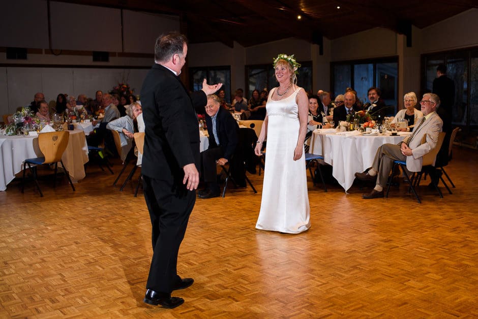 groom reaching out to bride for first dance