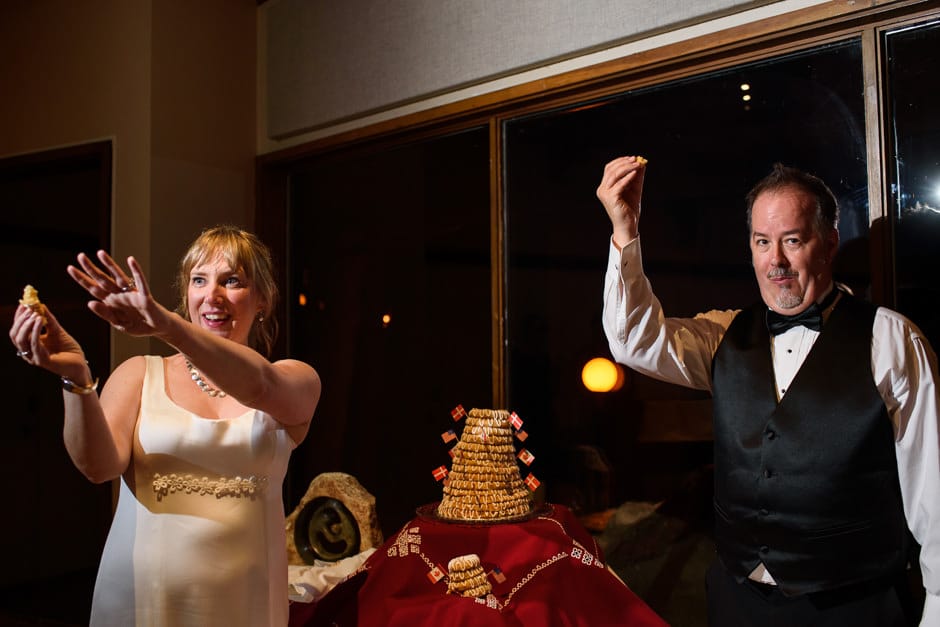 couple offering danish cake to guests