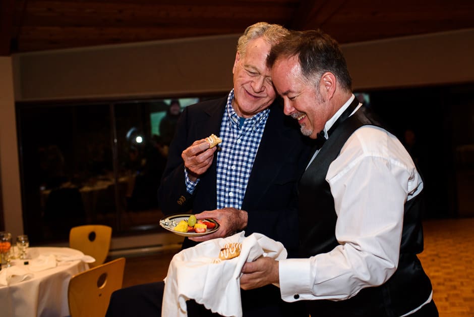 groom sharing danish wedding cake