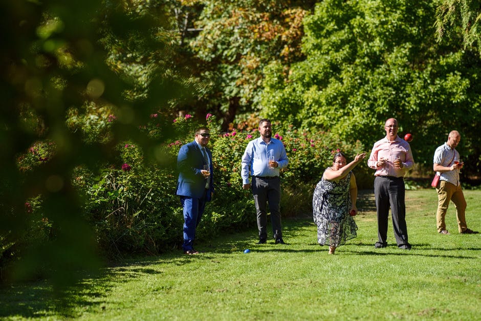 guests playing bocce at wedding reception