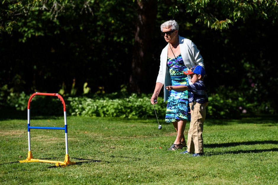 family playing ladder golf at wedding