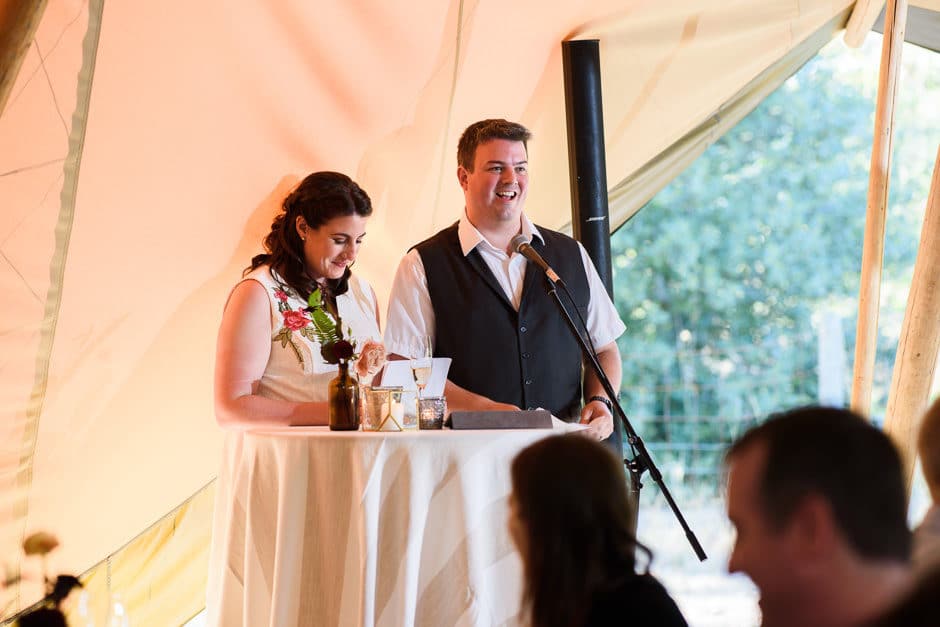 bride and groom giving toast