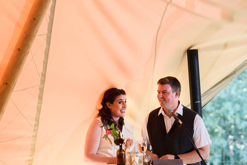 couple giving wedding toast