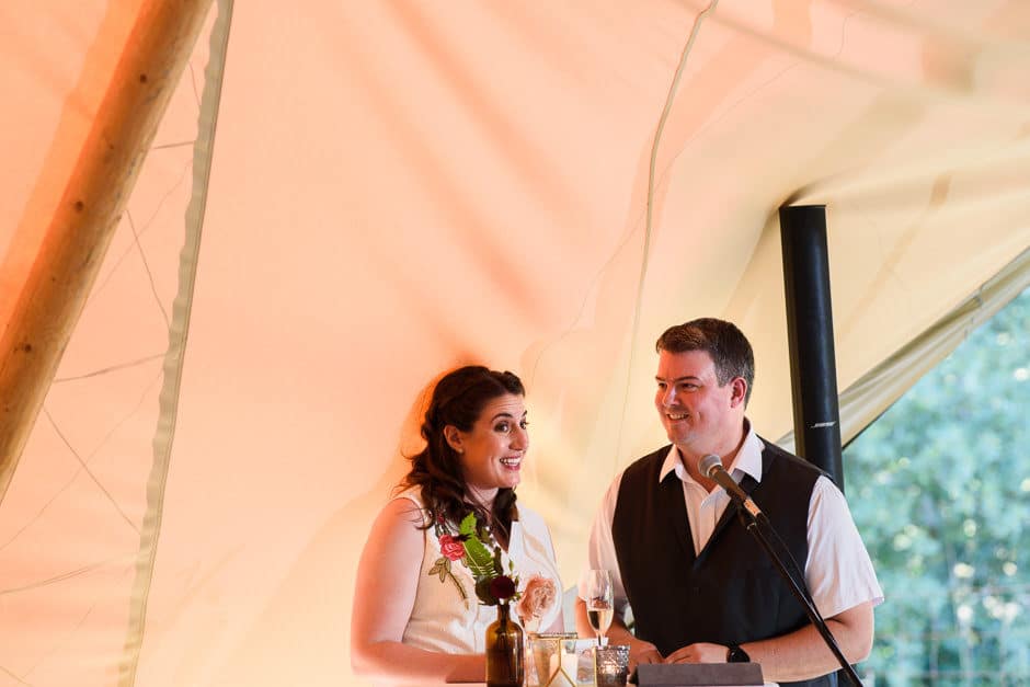 couple giving wedding toast