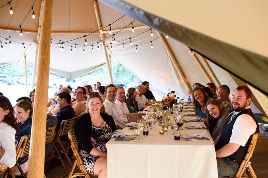 guests laughing at wedding toast