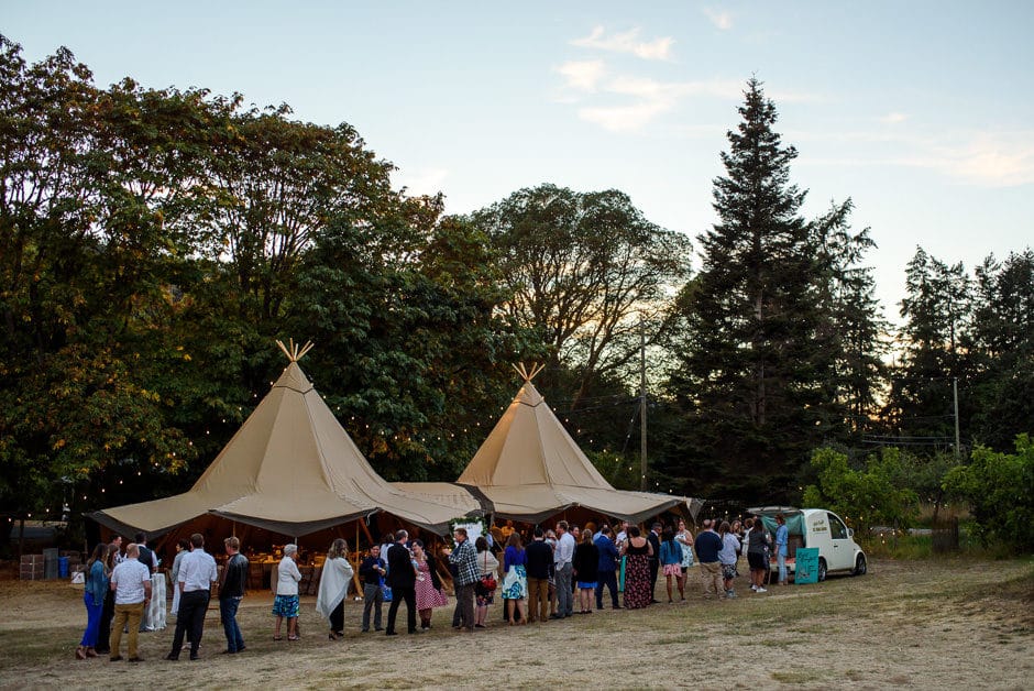 guests lining up for ice cream truck at wedding