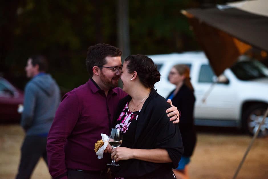 couple cuddling at reception