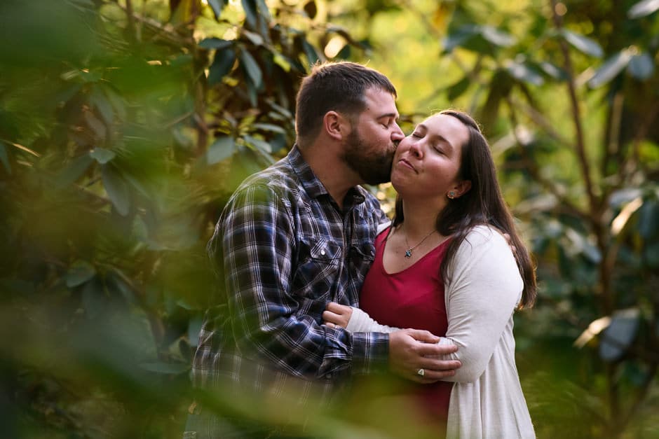 guy kissing girl on cheek