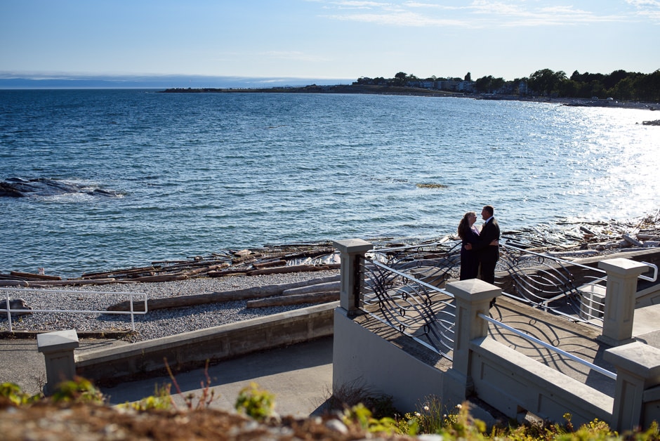 married couple posing on stairs