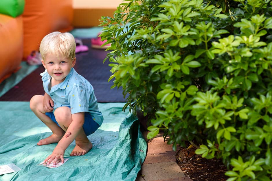 little boy playing in yard