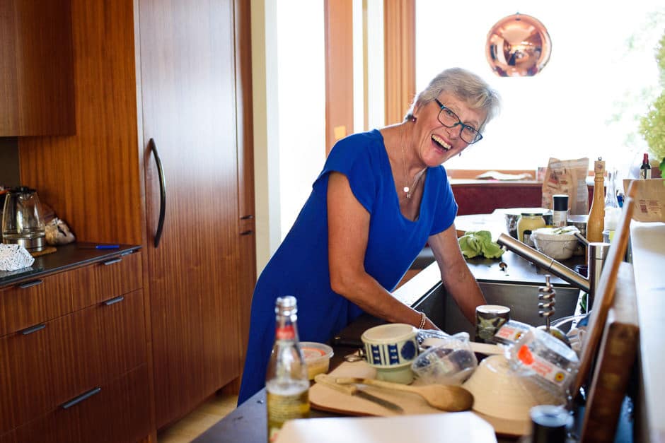 woman cleaning dishes at family gathering