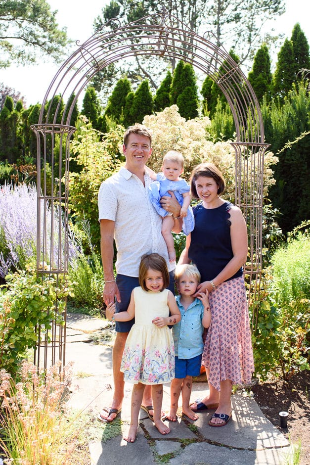 backlit family portrait in garden