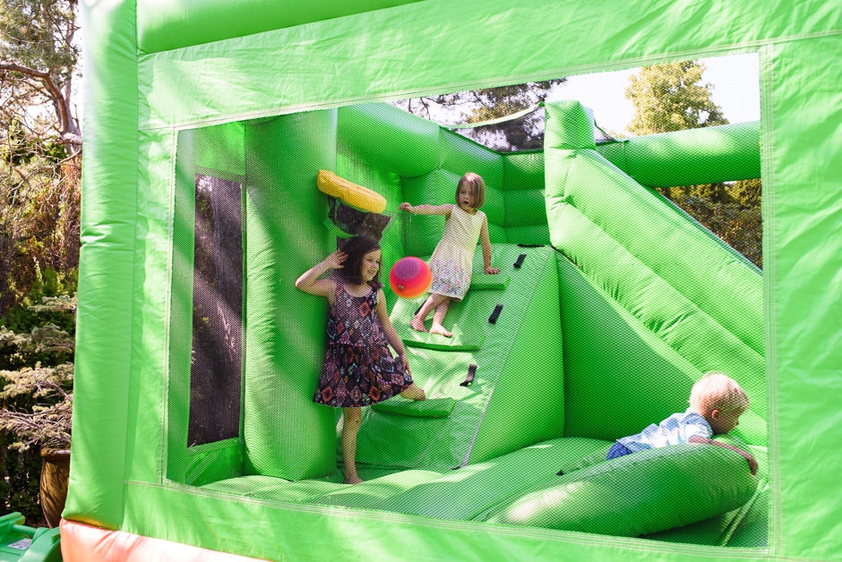 kids playing in bouncy castle