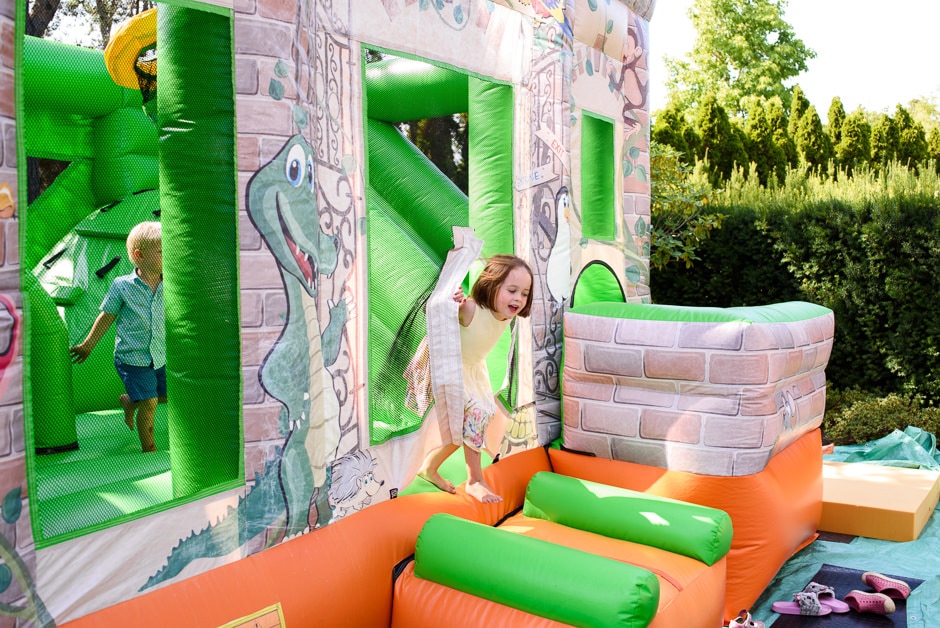 kid running out of bouncy castle