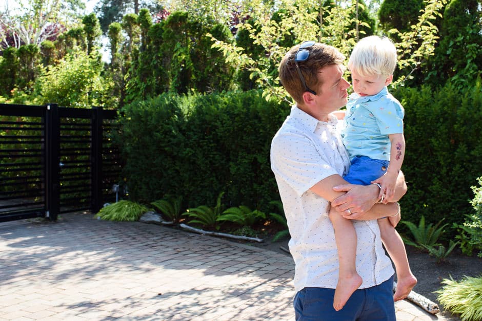 father comforting toddler son