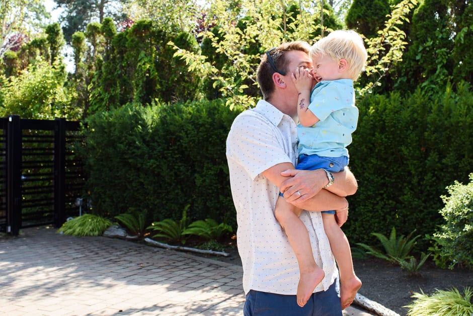 father making toddler laugh