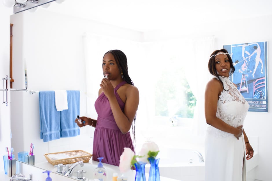 bride and teenage daughter getting ready for wedding