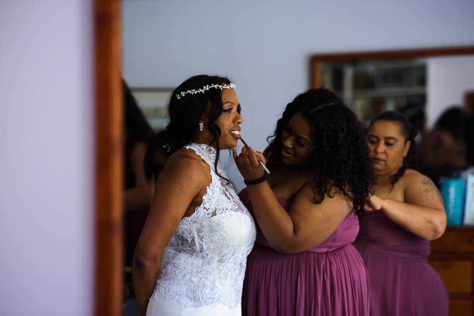 bridesmaids doing bride's makeup