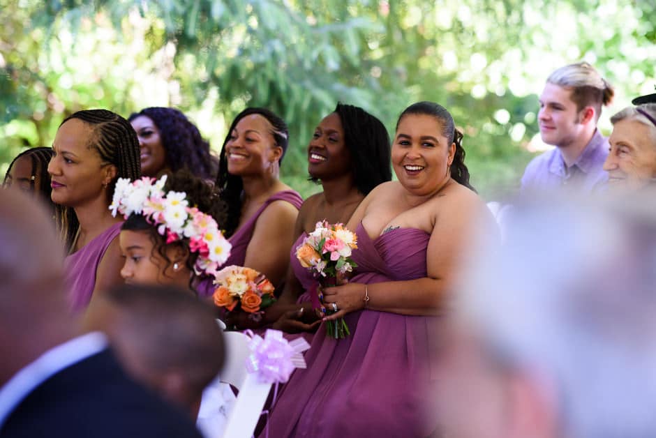 bridesmaids in audience of wedding ceremony