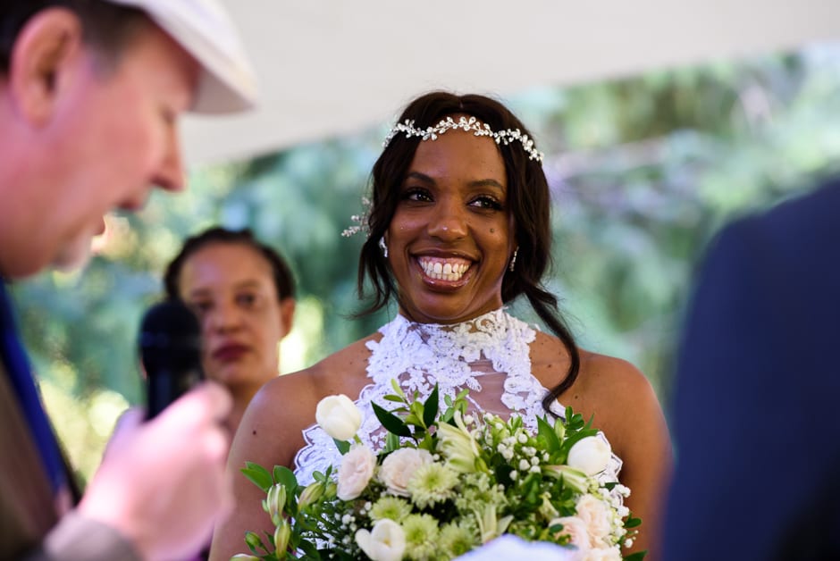 bride smiling during ceremony