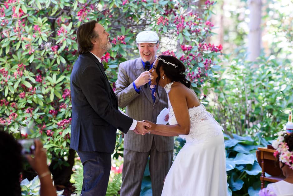 bride and groom laughing during wedding ceremony