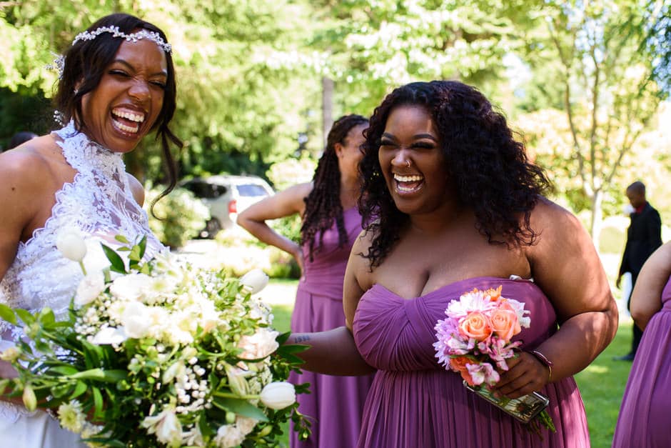 bridal party laughing after wedding ceremony